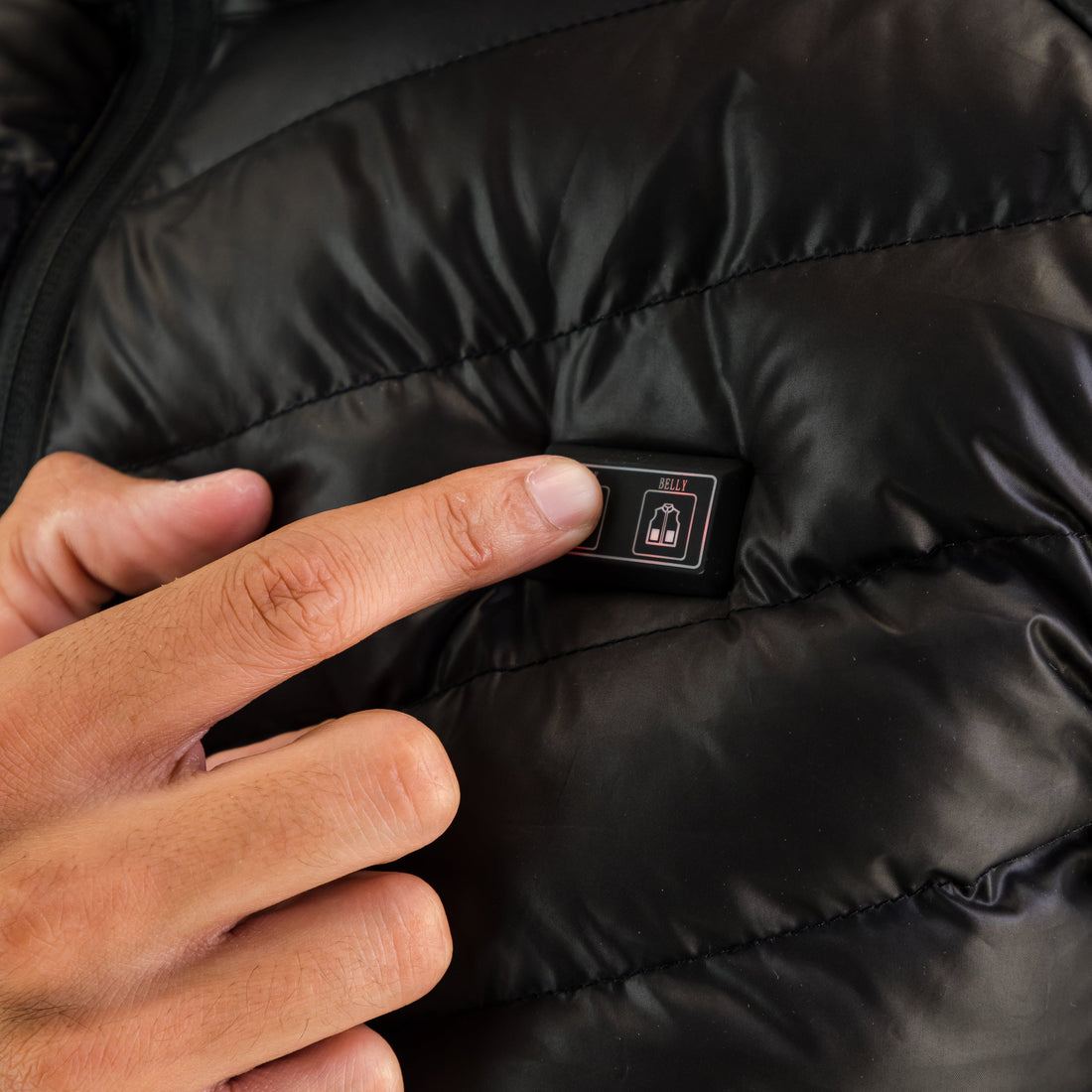Bedieningsknop van de Gløde Høgge verwarmde bodywarmer